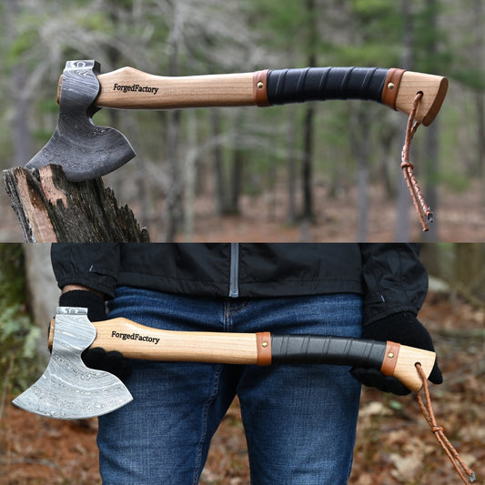 Axes with wooden handles and leather straps, one on a log, the other held by a person in a forest setting.