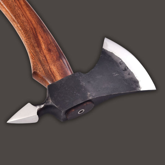 Close-up of a double-edged axe with a wooden handle on a dark background
