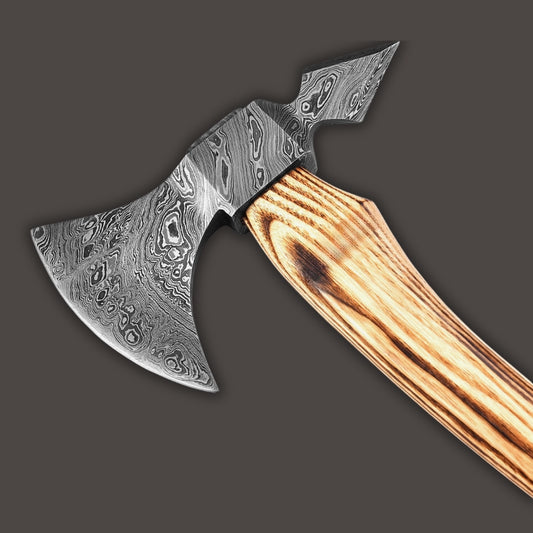 Decorative axe with a wooden handle on a gray background