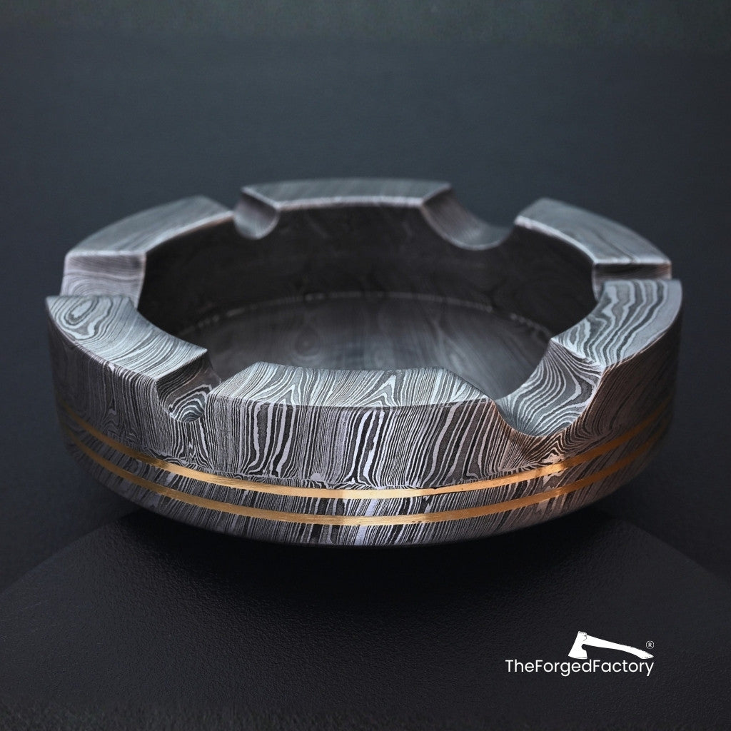 Decorative ashtray with intricate design on a dark background, branded 'TheForgedFactory'.