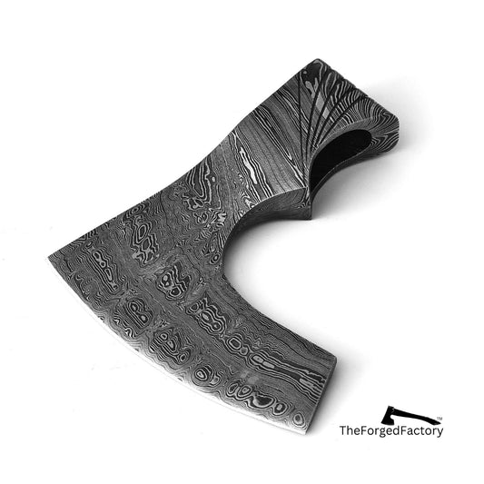 Decorative axe with intricate patterns on a white background, branded 'The Forged Factory'.
