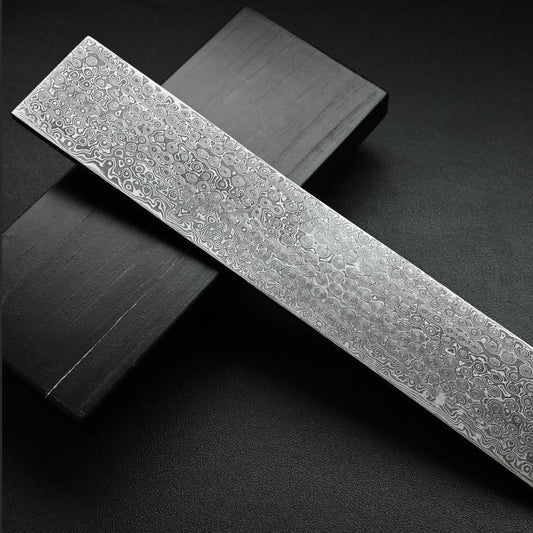 Decorative metal strip with intricate patterns on a dark background