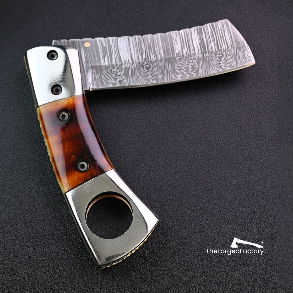 7.5-inch damascus steel folding pocket cigar cutter knife with bone handle on black background 
