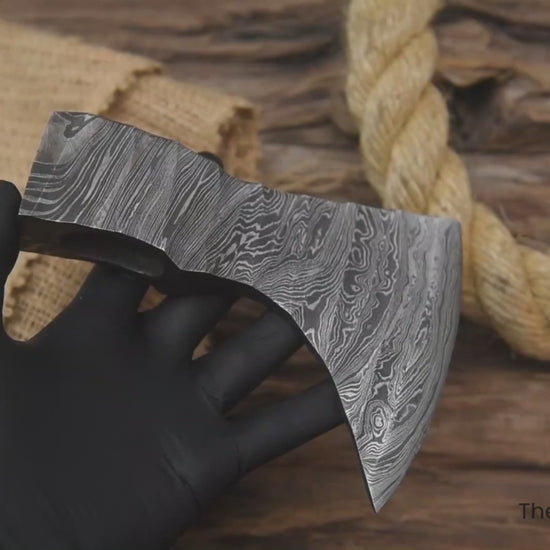 Multi-view Damascus steel axe head by “TheForgeFactory” for bushcraft, woodworking, and custom forged axe projects.