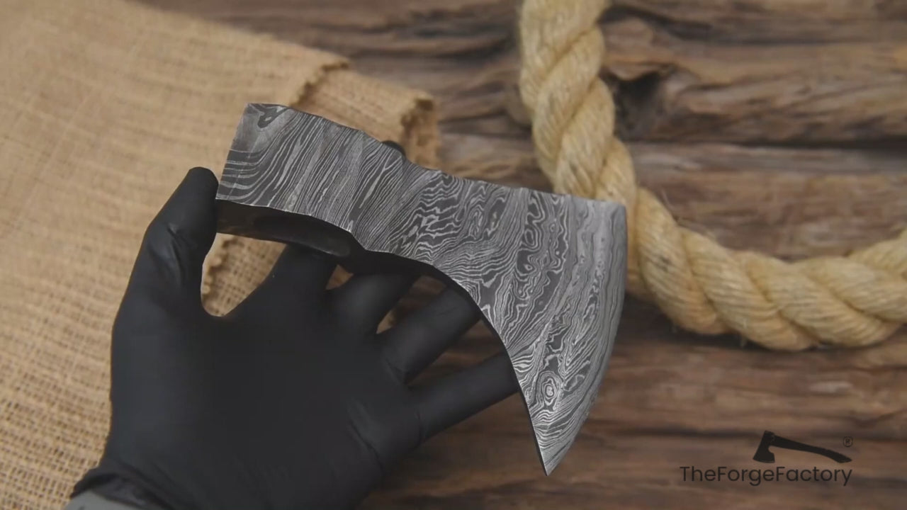 Multi-view Damascus steel axe head by “TheForgeFactory” for bushcraft, woodworking, and custom forged axe projects.