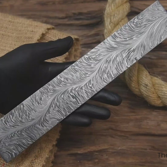 Close-up multi-view video of snake pattern Damascus steel billet block for knife making, blacksmithing, and custom blade builds.
