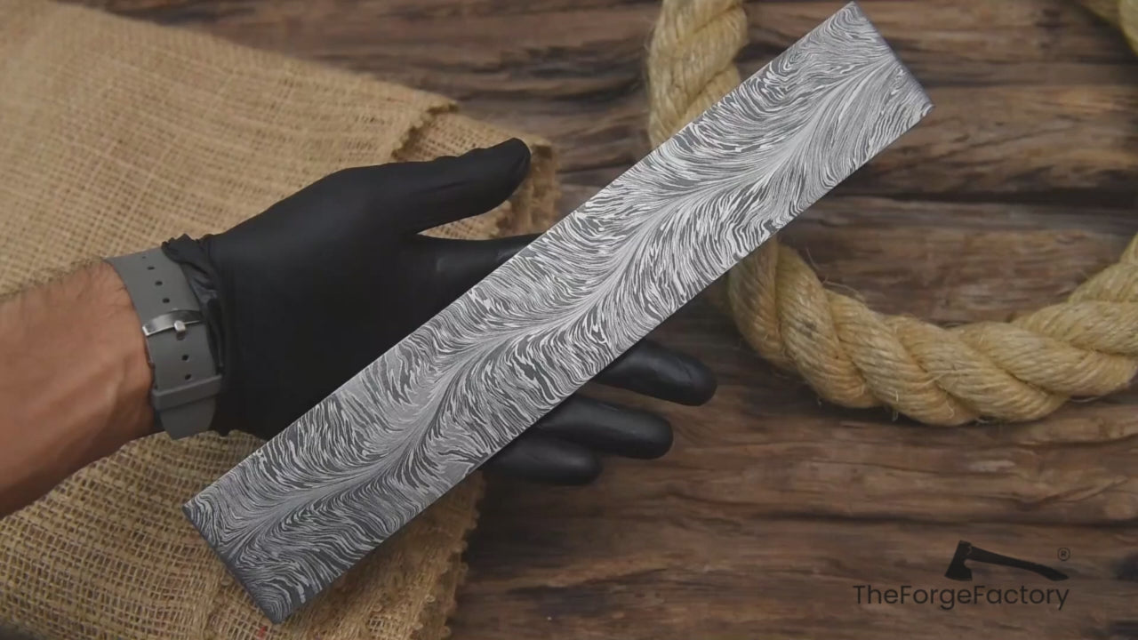 Close-up multi-view video of snake pattern Damascus steel billet block for knife making, blacksmithing, and custom blade builds.