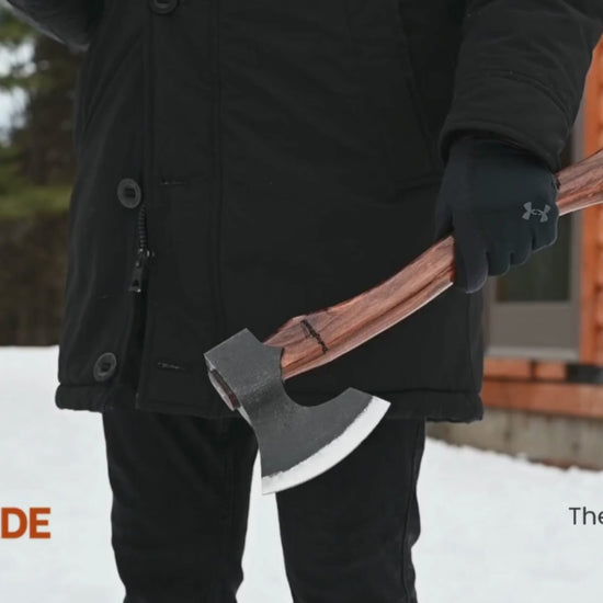 Multi-angle outdoor video of handmade carbon steel axe with wooden handle, showcasing forged bushcraft axe craftsmanship in a winter setting.