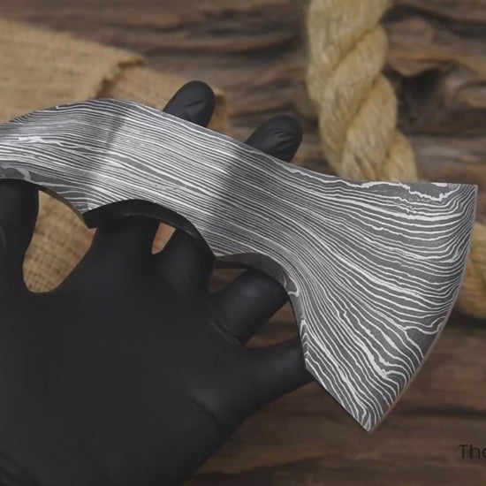 Close-up video of forged Damascus axe head designed for custom hatchet builds and outdoor craftsmanship projects.